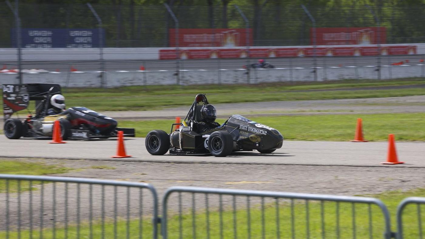 A racecar on the track during a competiton.